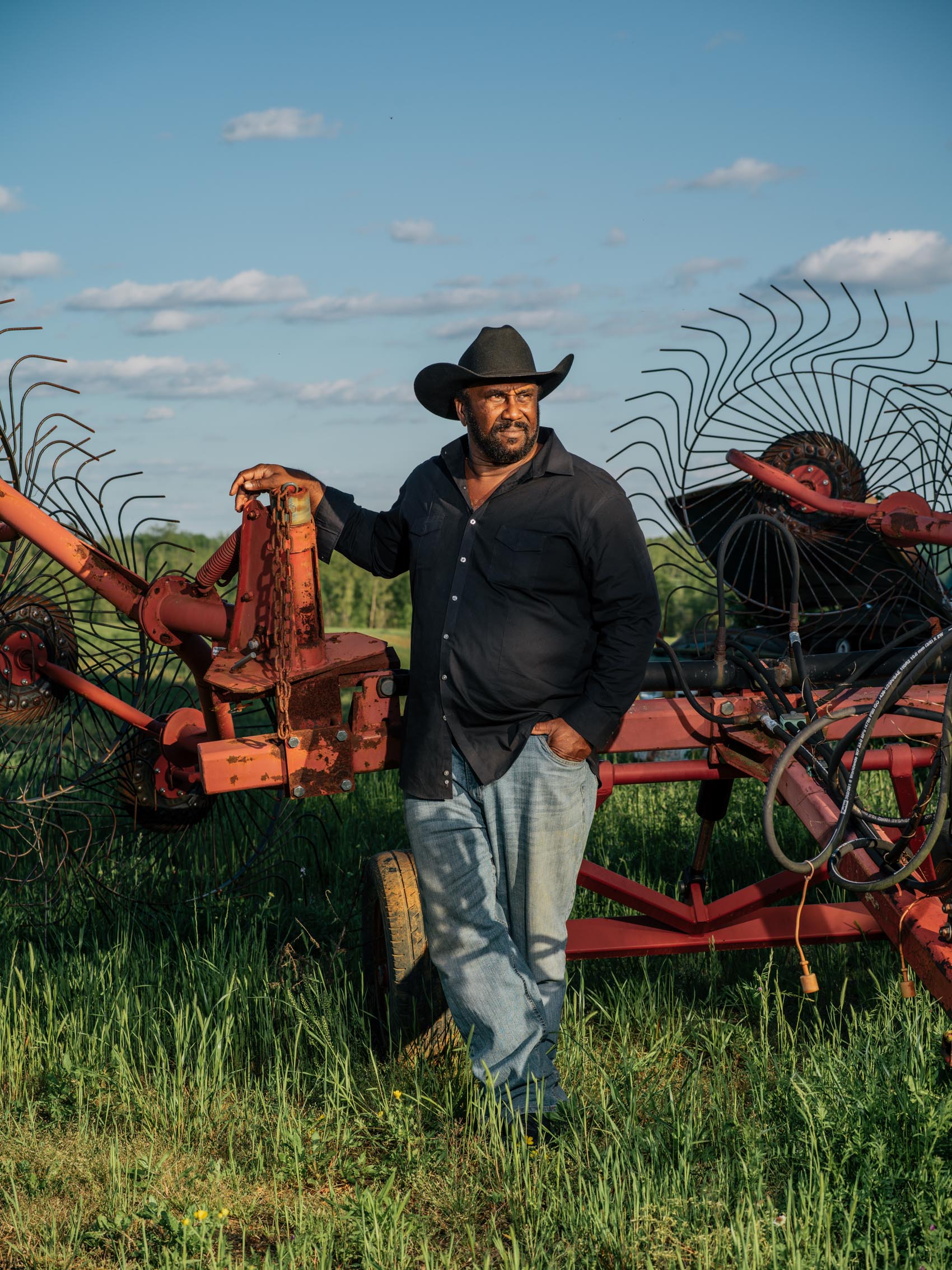 John Boyd Jr. black farmer next to plow