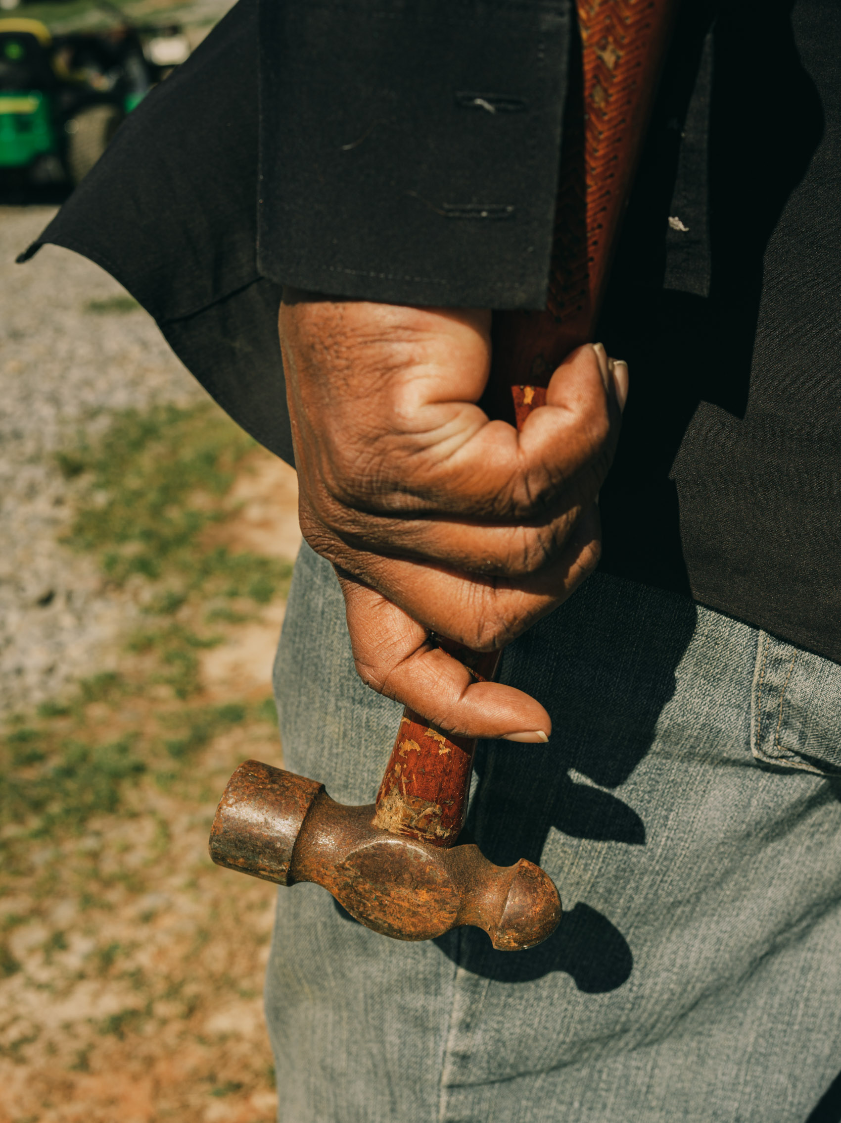 farmer carrying a hammer