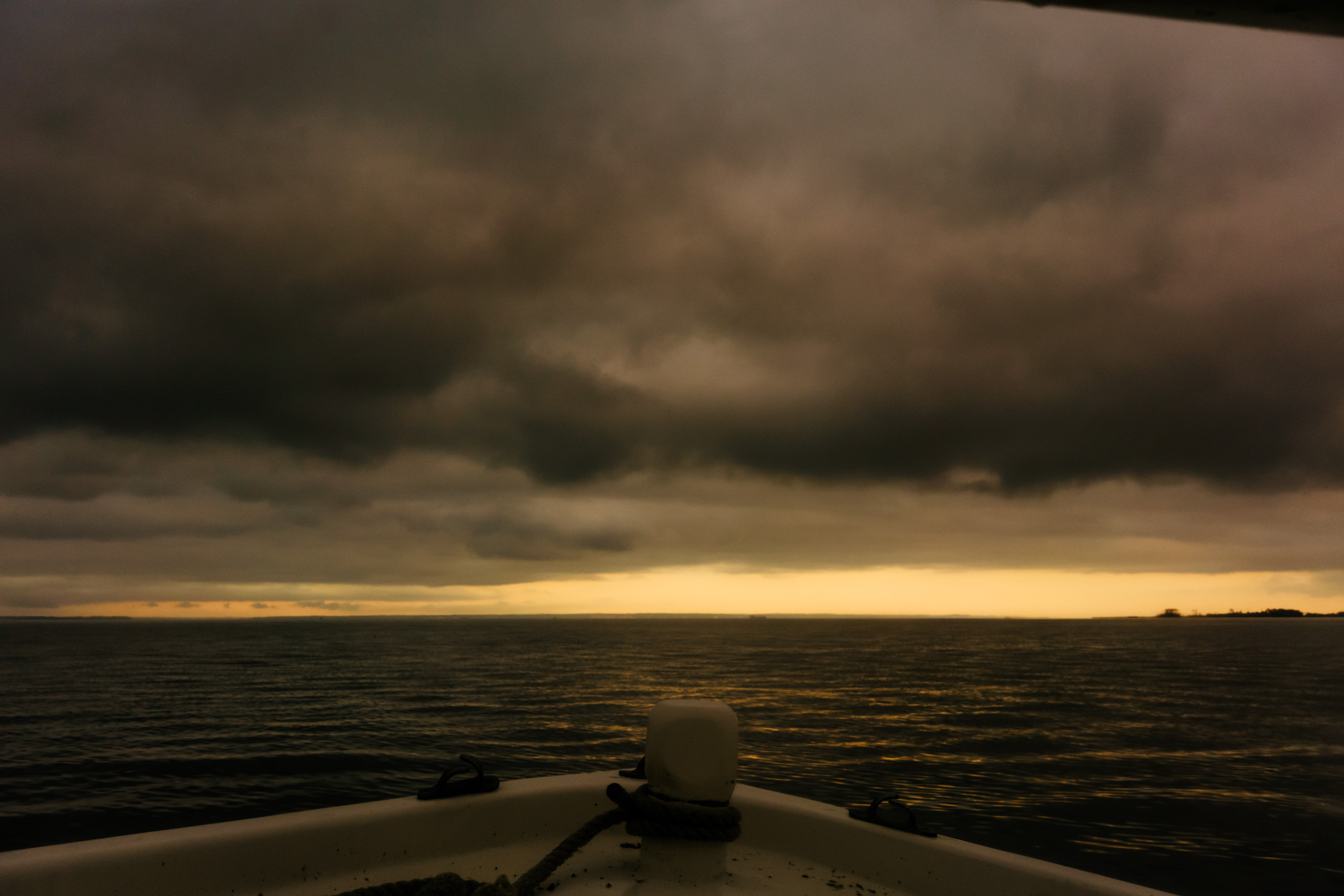 storm clouds over the Chesapeake Bay in early morning sunrise