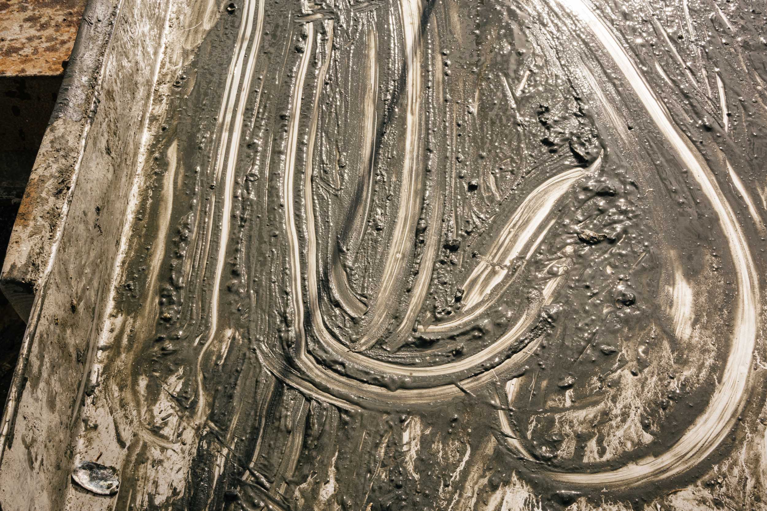mud streaks on metal table 