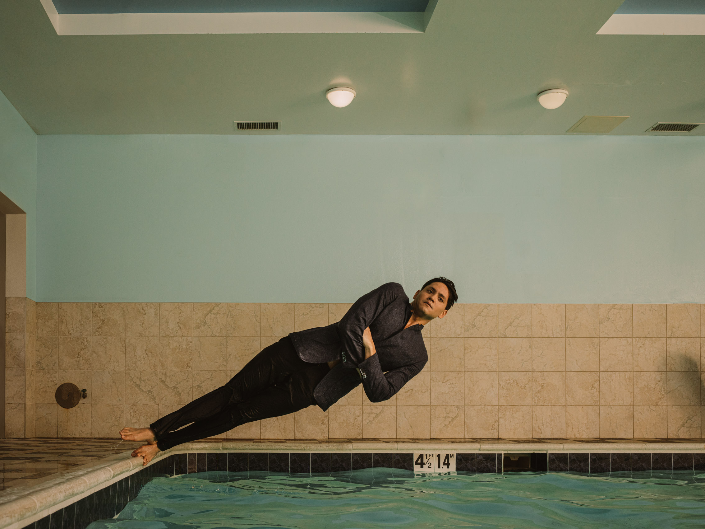Joseph Schooling swimmer portrait falling into pool
