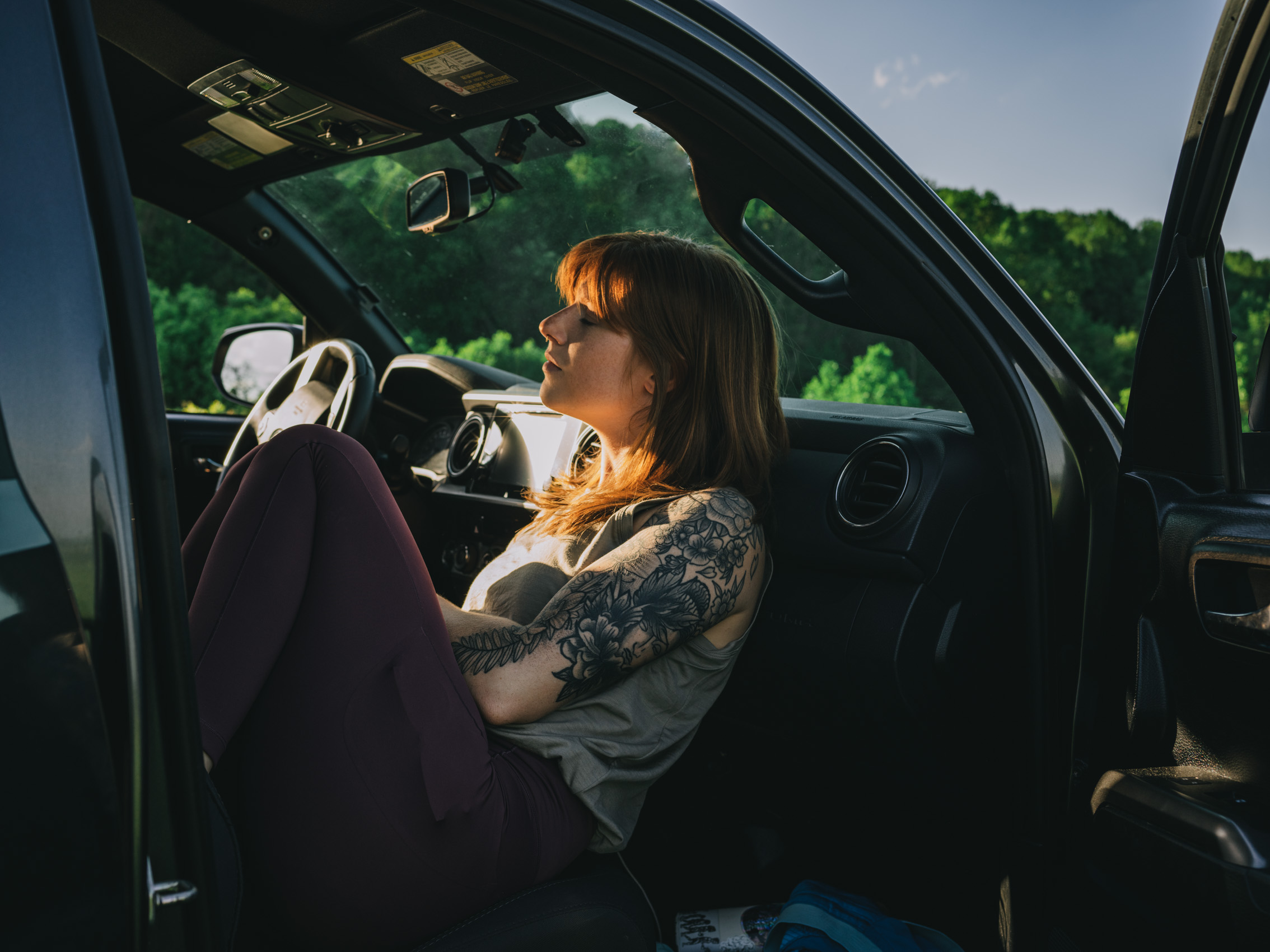 Arcteryx brand photography woman sitting in car