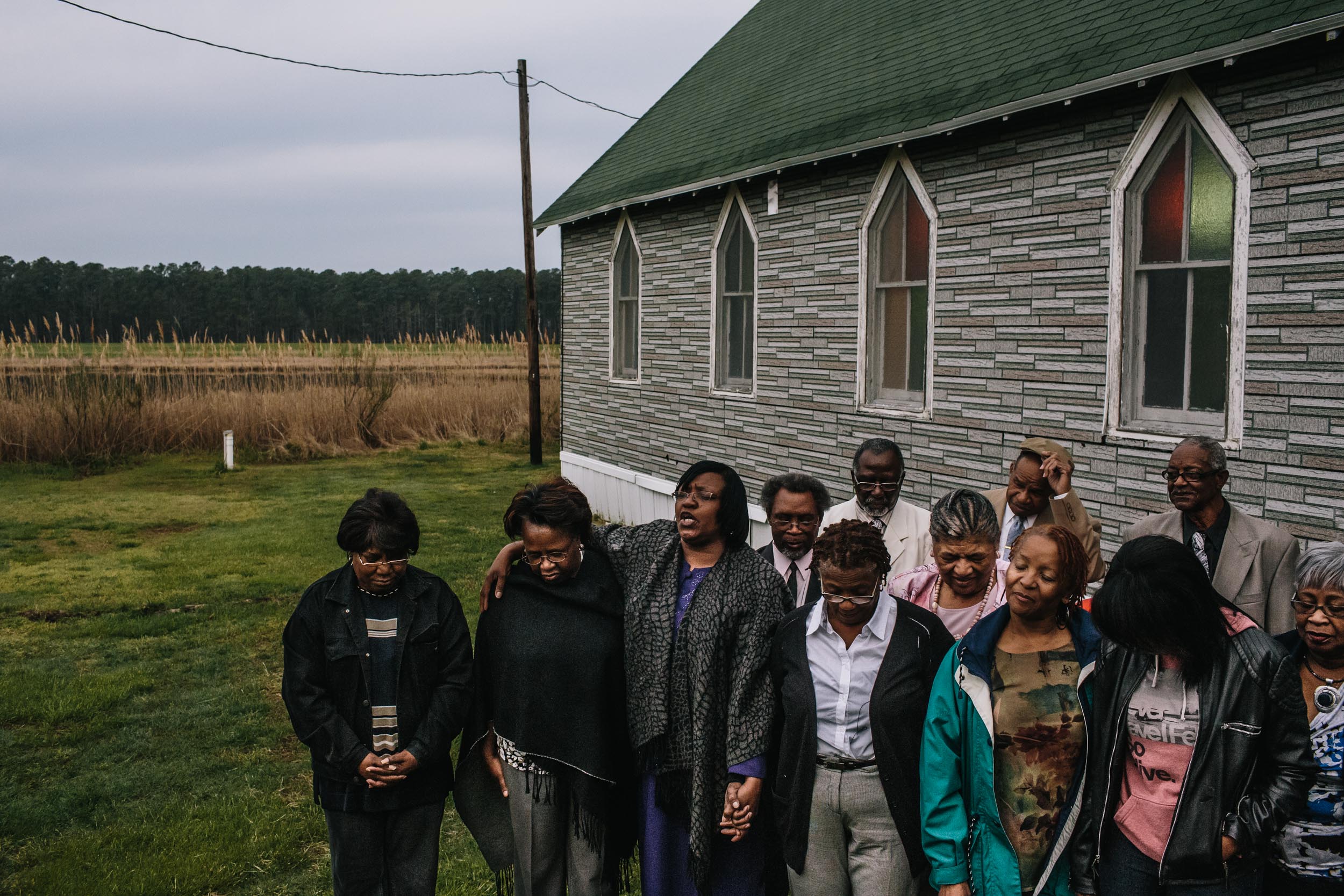 Members of the New Revived Methodist Church in Madison, Md pray outside during the sunrise service on Easter morning