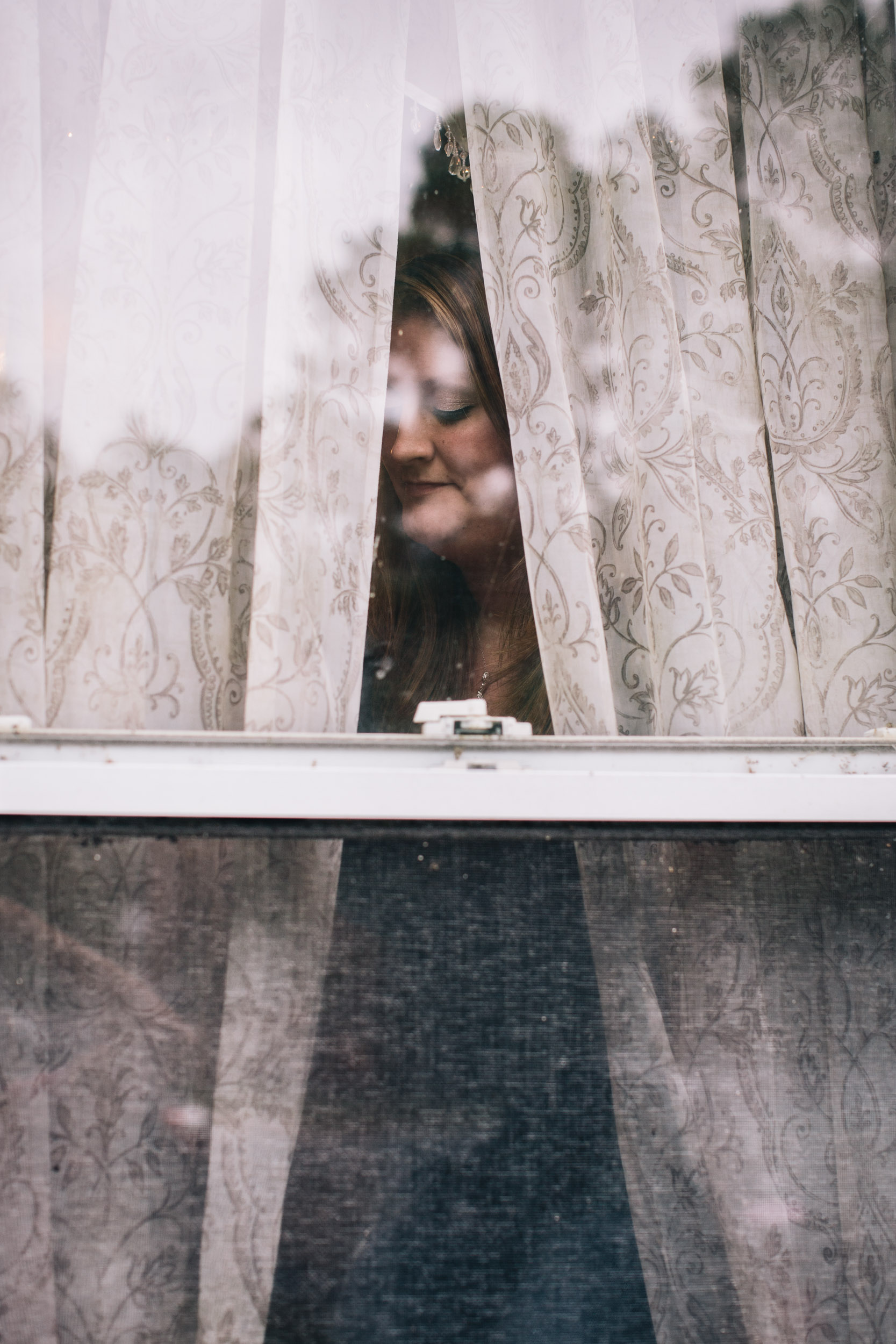 portrait of woman through window