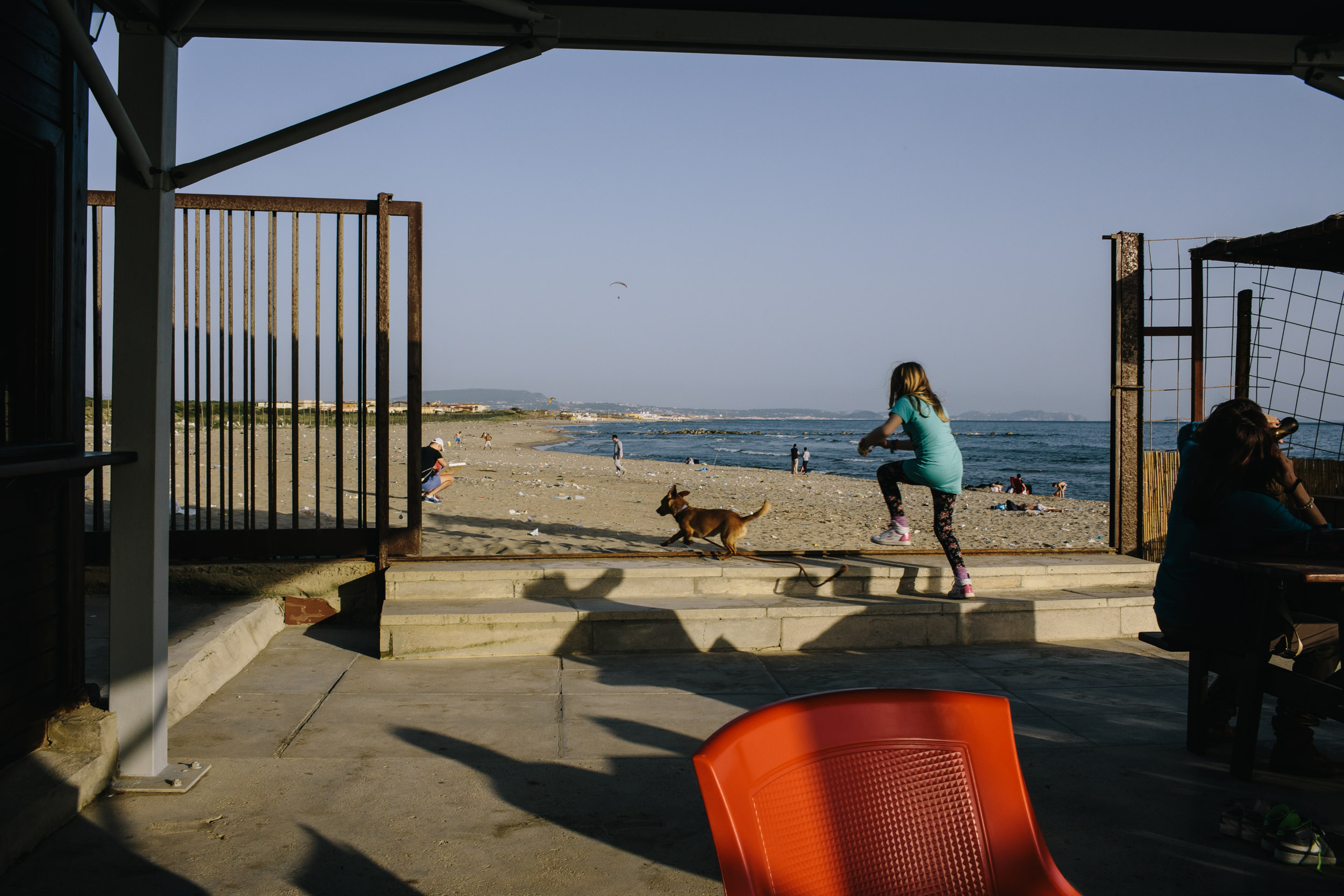 Residents spend an afternoon at the Villaggio Coppola public beach