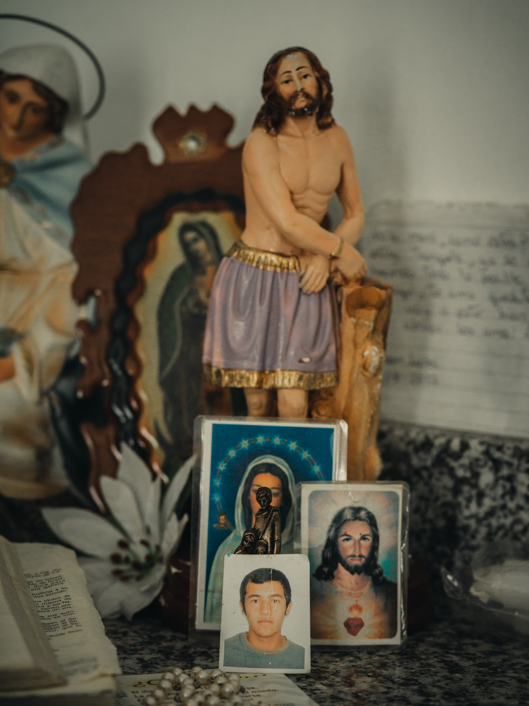 Jesus statue and photo of child at home of Venezuelan refugee