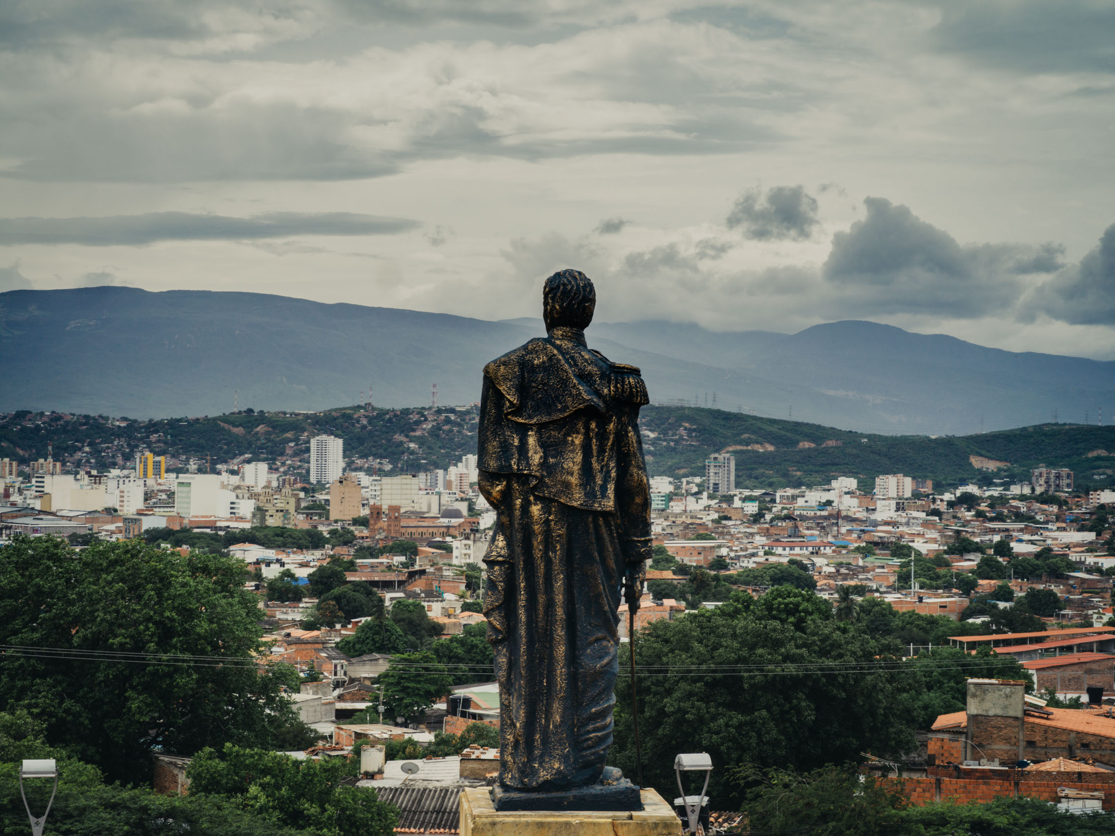 A statue of Simón Bolí­var stands atop a hill overlooking the city of Cúcuta, Colombia