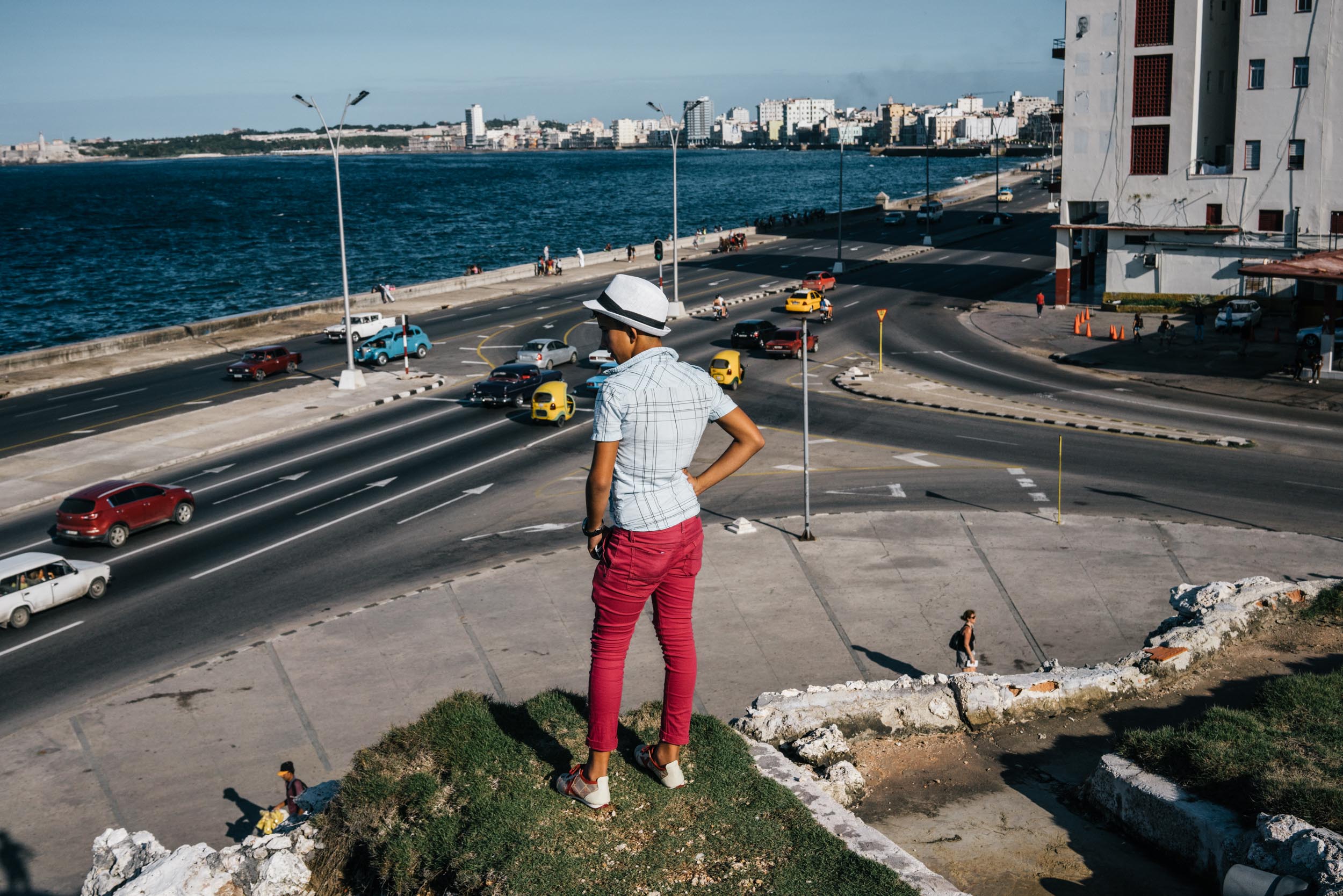 teenager standing on hill overlooking Havana