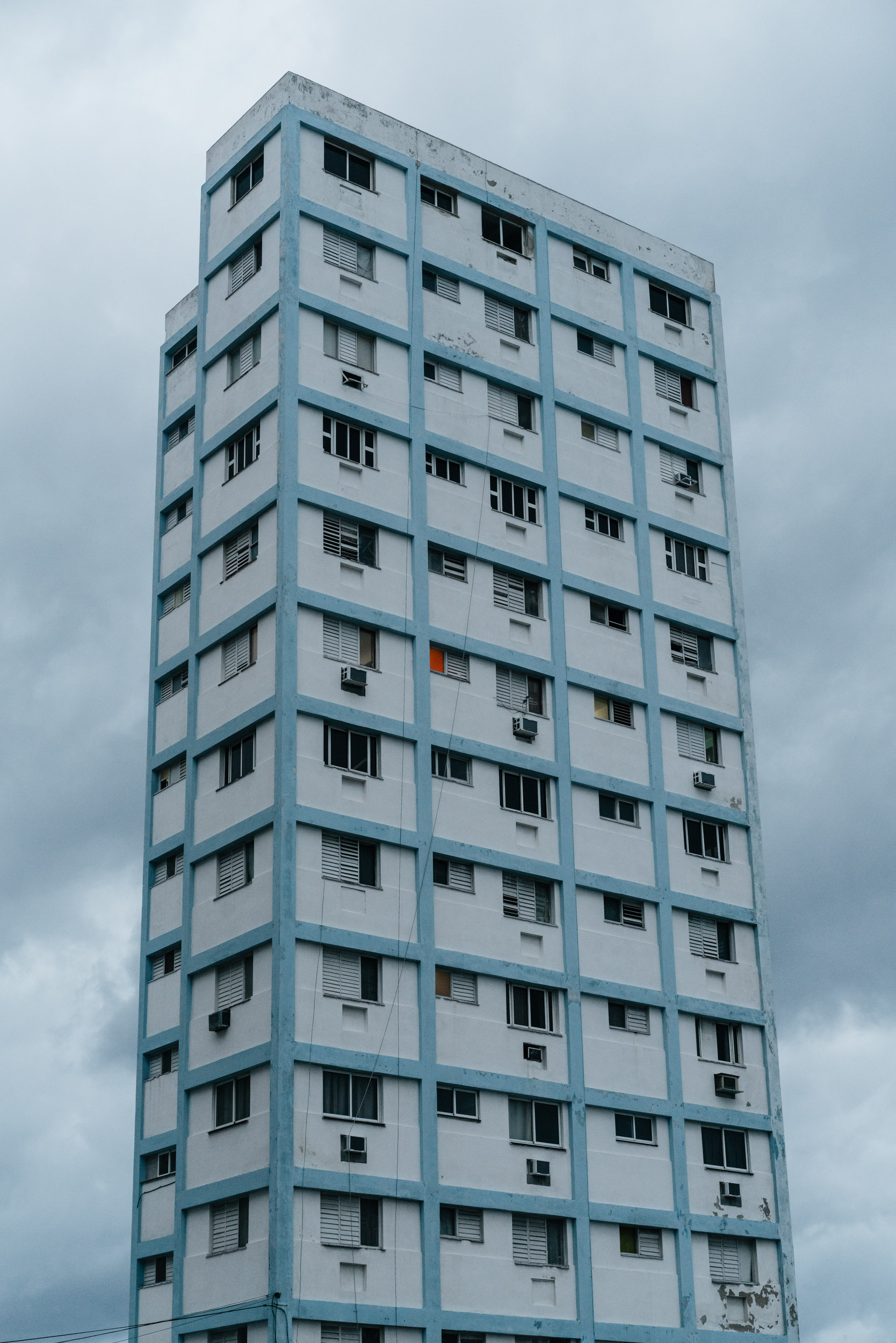tall blue building with sky