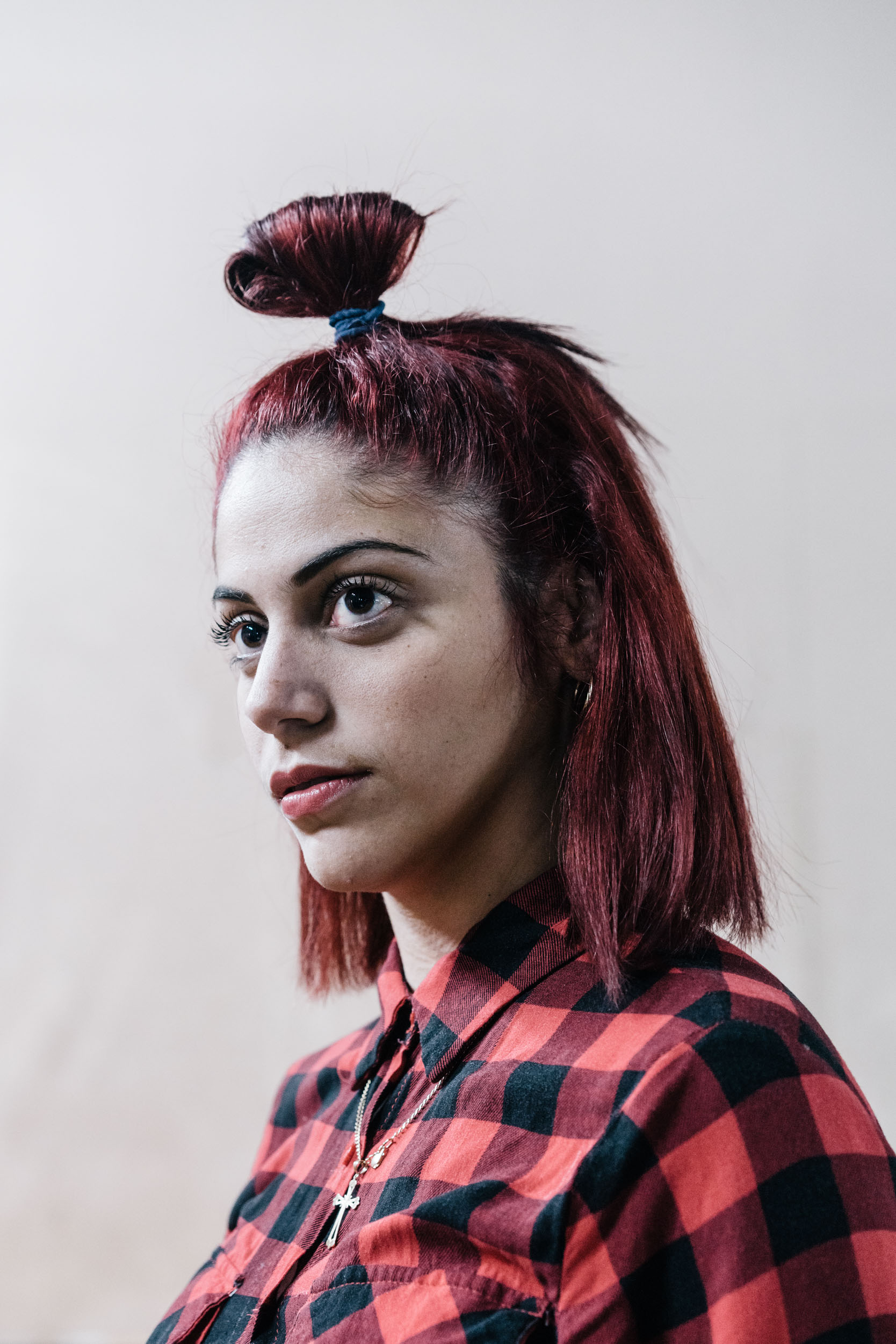 portrait of dancer with top knot red hair